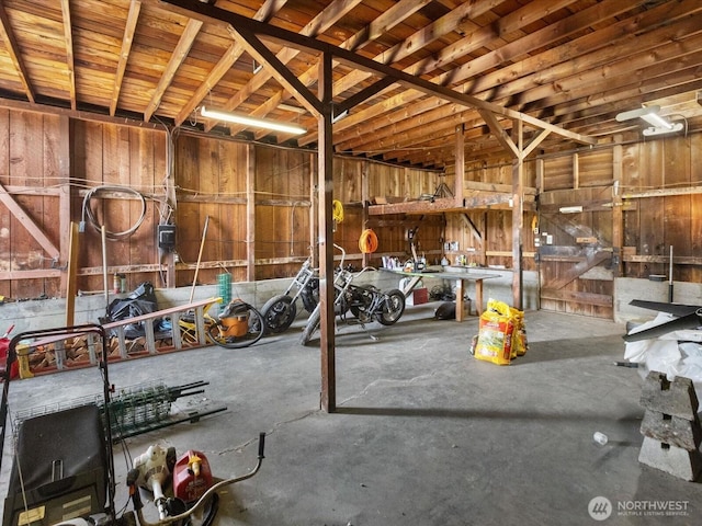 misc room with concrete flooring and a garage