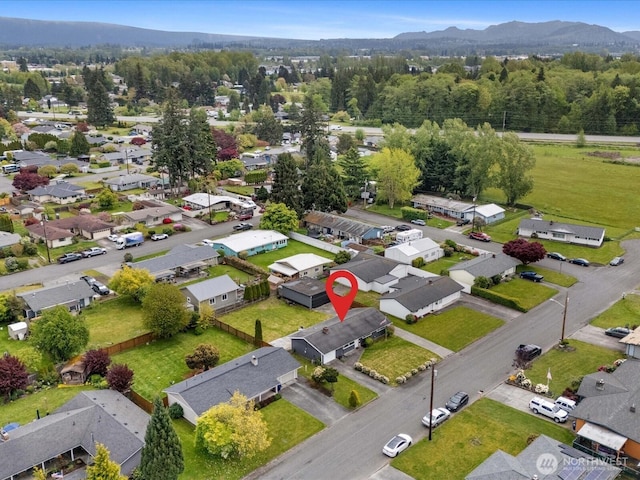 birds eye view of property with a residential view and a mountain view