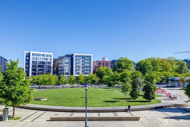 view of home's community featuring a lawn
