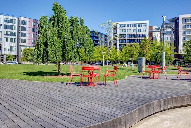 view of community with a yard and a deck