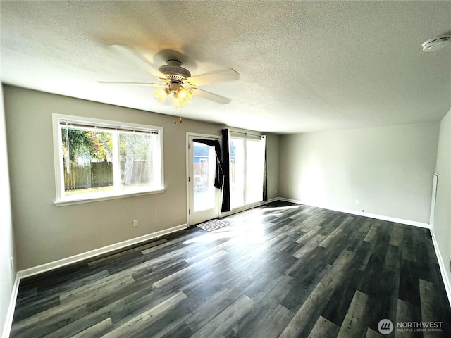 19573 2nd Ave NE, Poulsbo, WA 98366 - unfurnished room with a textured ceiling, plenty of natural light, a ceiling fan, and wood finished floors