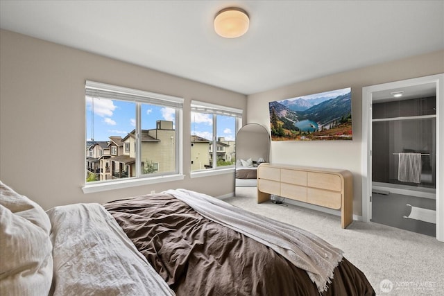 bedroom featuring baseboards and carpet
