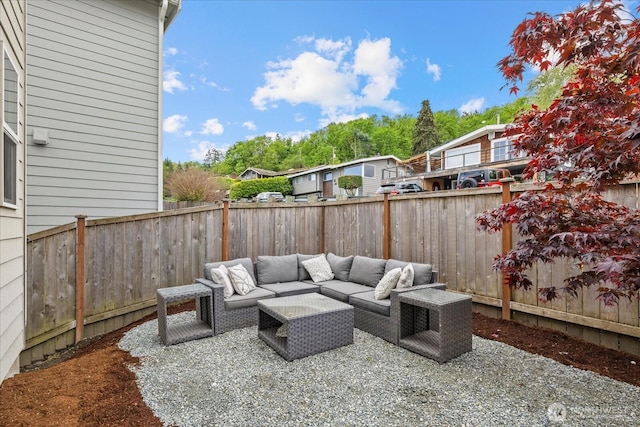 view of patio / terrace featuring an outdoor living space and a fenced backyard