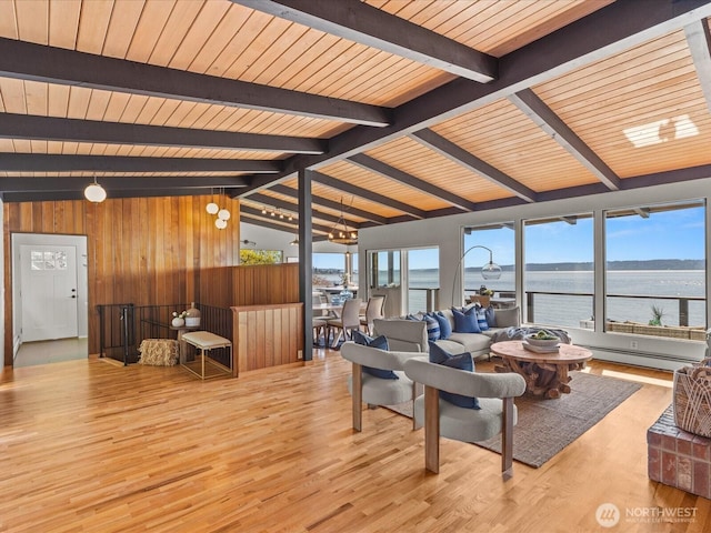 2690 SW 151st Pl, Burien, WA 98166 - living room featuring wood walls, wood finished floors, a baseboard radiator, a water view, and lofted ceiling with beams