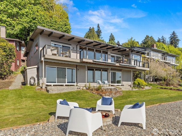2690 SW 151st Pl, Burien, WA 98166 - back of house featuring a lawn and a balcony