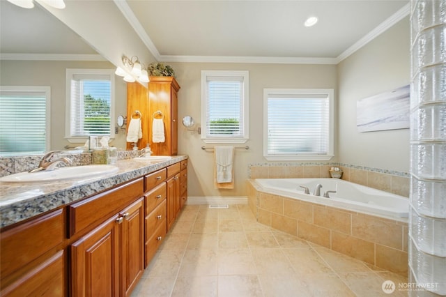 2961 Kendall Rd, Walla Walla, WA 99362 - full bath with double vanity, a garden tub, tile patterned floors, crown molding, and baseboards