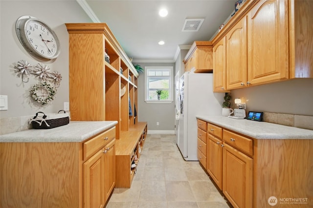 2961 Kendall Rd, Walla Walla, WA 99362 - laundry room with cabinet space, ornamental molding, recessed lighting, and baseboards