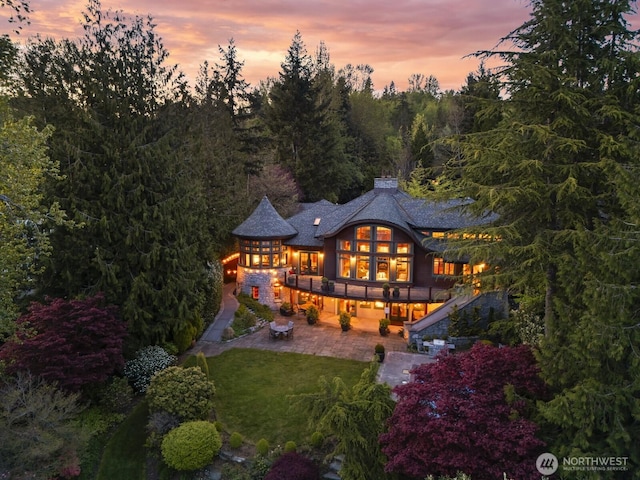 2141 Northshore Rd, Bellingham, WA 98226 - back of house with stairs, a deck, a chimney, a patio area, and a lawn