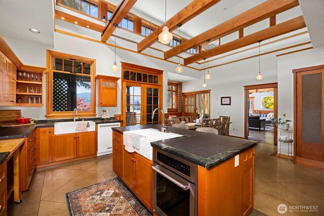 2141 Northshore Rd, Bellingham, WA 98226 - kitchen featuring white dishwasher, dark countertops, a sink, and oven