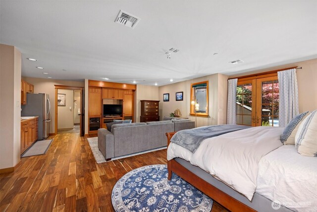 2141 Northshore Rd, Bellingham, WA 98226 - bedroom with visible vents, freestanding refrigerator, recessed lighting, light wood-type flooring, and french doors