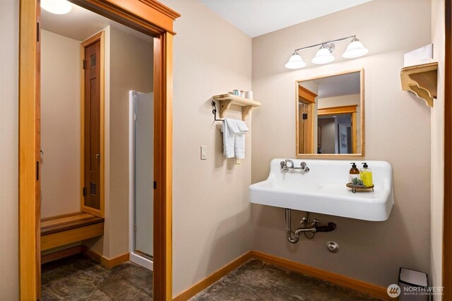 2141 Northshore Rd, Bellingham, WA 98226 - bathroom featuring baseboards, a sink, and a stall shower
