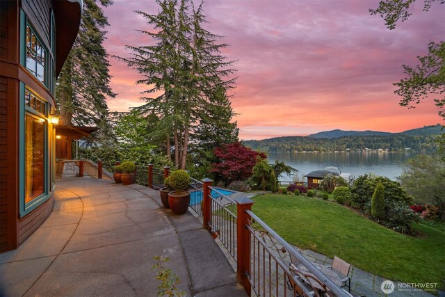 2141 Northshore Rd, Bellingham, WA 98226 - patio terrace at dusk featuring a water and mountain view and a yard
