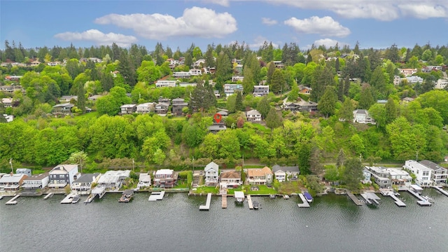 birds eye view of property featuring a water view and a residential view