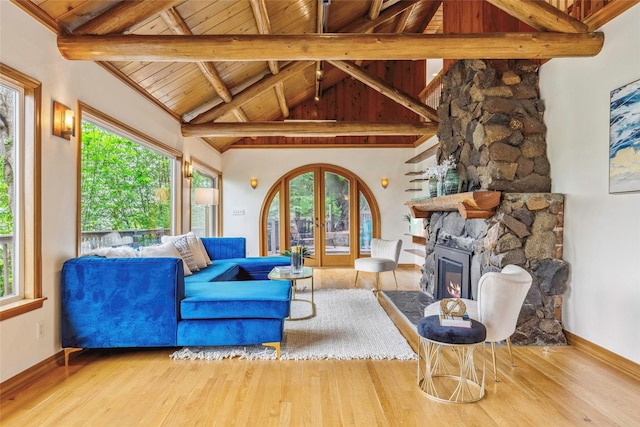 living room featuring wooden ceiling, french doors, and wood finished floors