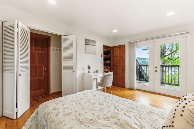 bedroom featuring french doors, access to exterior, wood finished floors, baseboards, and recessed lighting