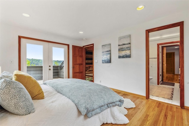 bedroom with french doors, access to exterior, baseboards, light wood finished floors, and recessed lighting