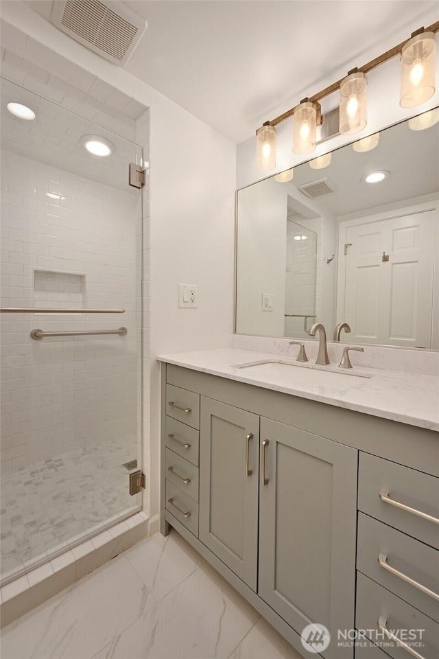 2320 43rd Ave E Unit 15A, Seattle, WA 98112 - full bath with a shower stall, marble look tile flooring, vanity, and recessed lighting