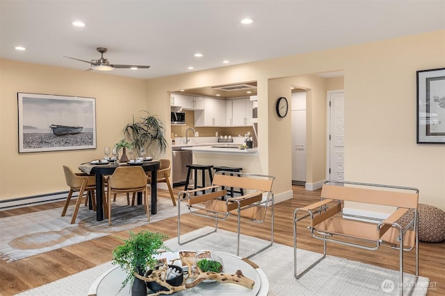 2320 43rd Ave E Unit 15A, Seattle, WA 98112 - living room featuring light wood finished floors, ceiling fan, recessed lighting, and baseboards