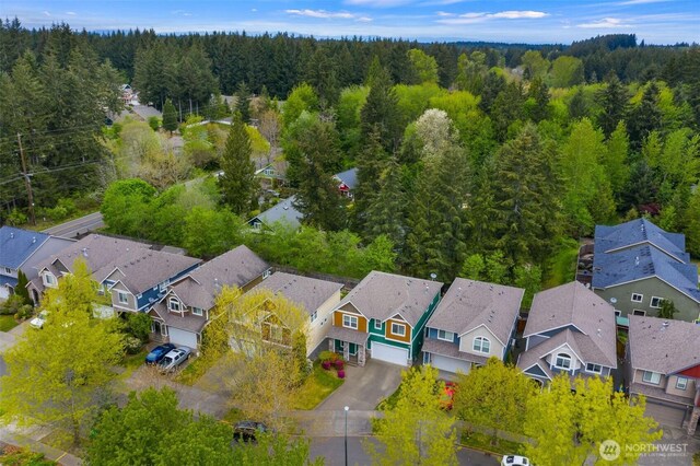 aerial view featuring a residential view and a view of trees