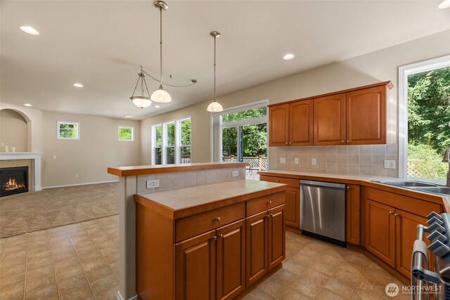 4504 5th Ave NW, Olympia, WA 98502 - kitchen featuring dishwasher, tile countertops, brown cabinets, plenty of natural light, and recessed lighting