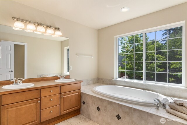 4504 5th Ave NW, Olympia, WA 98502 - bathroom featuring a garden tub, double vanity, and tile patterned floors