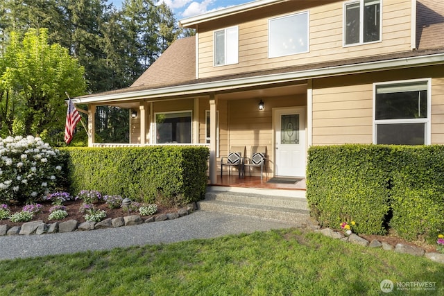 8957 Watson Pl NE, Bremerton, WA 98311 - doorway to property featuring covered porch and a shingled roof
