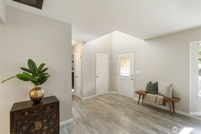 8957 Watson Pl NE, Bremerton, WA 98311 - entryway with baseboards and light wood-style flooring