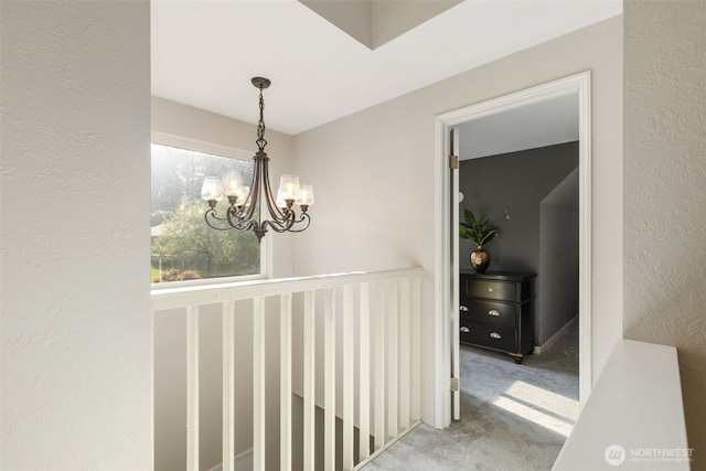 8957 Watson Pl NE, Bremerton, WA 98311 - hall with a chandelier, carpet, and a textured wall