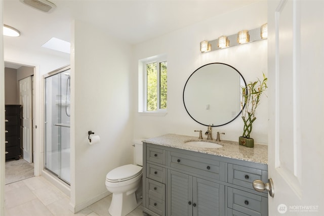 8957 Watson Pl NE, Bremerton, WA 98311 - full bath featuring tile patterned floors, a stall shower, toilet, and vanity