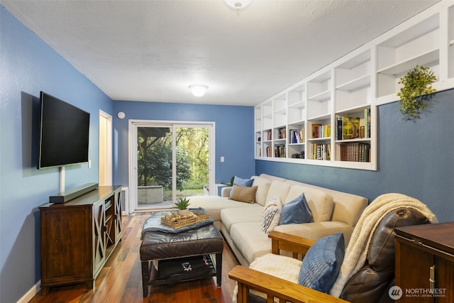 8957 Watson Pl NE, Bremerton, WA 98311 - living room featuring baseboards and wood finished floors