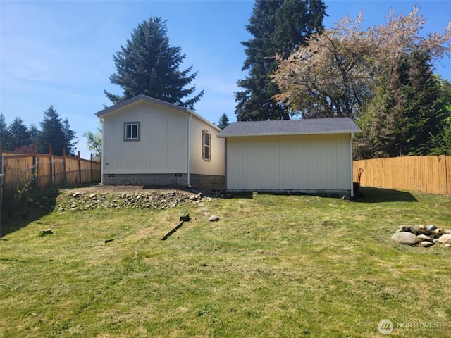 exterior space featuring fence and a yard