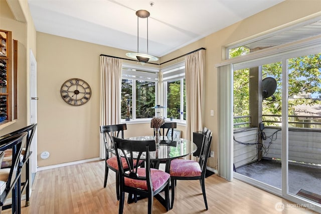 dining area with light wood-style flooring