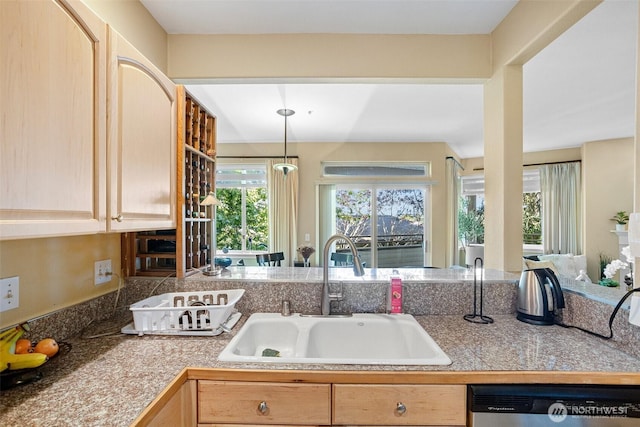 kitchen with tile countertops, decorative light fixtures, dishwasher, a sink, and light brown cabinets