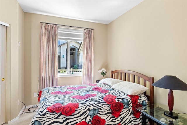 carpeted bedroom with baseboards