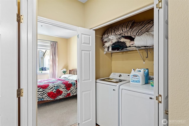 washroom featuring laundry area, carpet floors, and washer and dryer