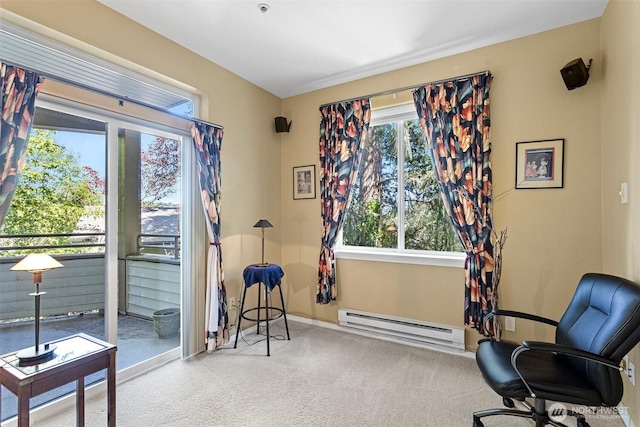 office space with carpet floors, a baseboard radiator, and baseboards