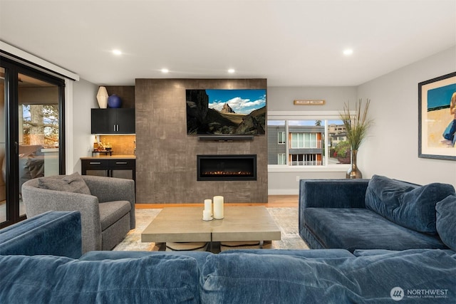 807 Lake St S Unit 300, Kirkland, WA 98033 - living room with recessed lighting, a tiled fireplace, and light wood-style floors