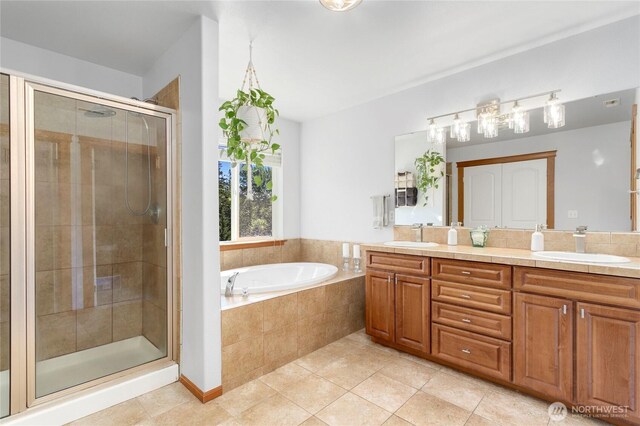 full bath featuring a shower stall, a bath, tile patterned floors, and double vanity