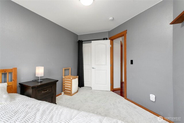 carpeted bedroom with baseboards
