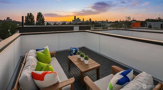 balcony featuring an outdoor living space and a city view