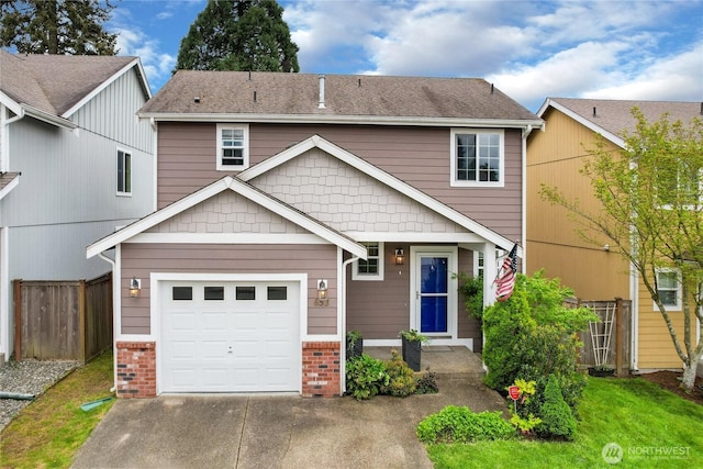 view of front of property with brick siding, a garage, fence, and concrete driveway