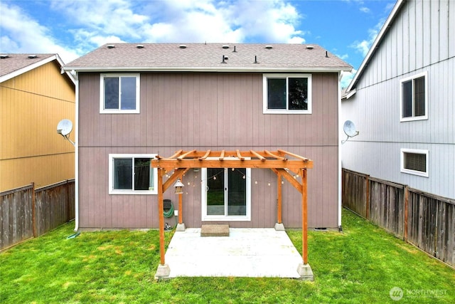 back of property featuring a pergola, a fenced backyard, roof with shingles, a patio area, and a yard