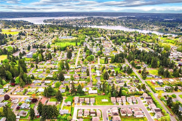birds eye view of property featuring a water view and a residential view
