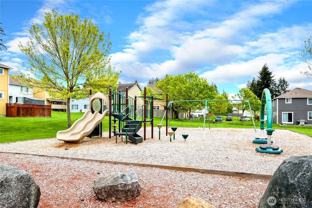 community play area with a lawn