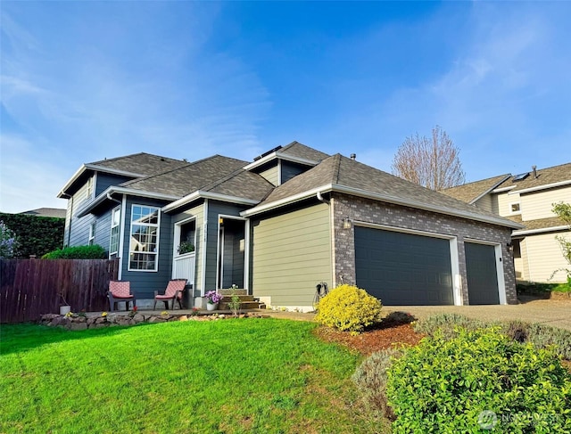 view of front of house with a garage, fence, a front yard, and concrete driveway