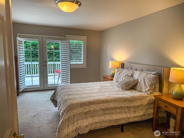 carpeted bedroom featuring access to exterior