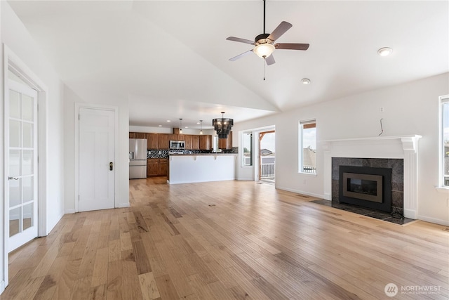 5208 Tumac Dr, Yakima, WA 98901 - unfurnished living room with a fireplace, light wood-style floors, high vaulted ceiling, a ceiling fan, and recessed lighting