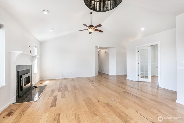 5208 Tumac Dr, Yakima, WA 98901 - unfurnished living room featuring ceiling fan, visible vents, a tiled fireplace, and light wood-style floors