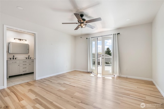 5208 Tumac Dr, Yakima, WA 98901 - spare room with a sink, baseboards, ceiling fan, and light wood-style flooring