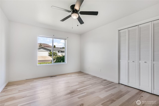 5208 Tumac Dr, Yakima, WA 98901 - unfurnished bedroom with a closet, baseboards, visible vents, and light wood-type flooring